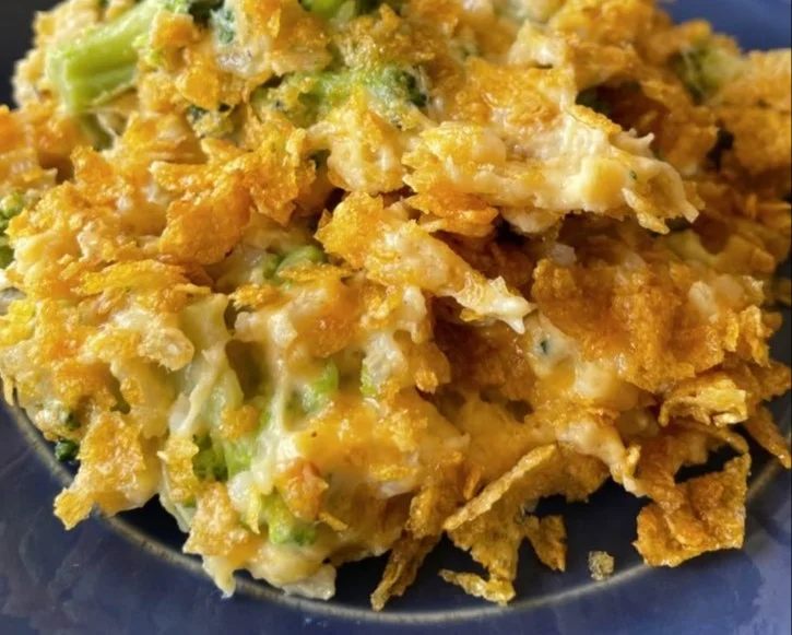 Cheesy chicken broccoli rice casserole served in a dish