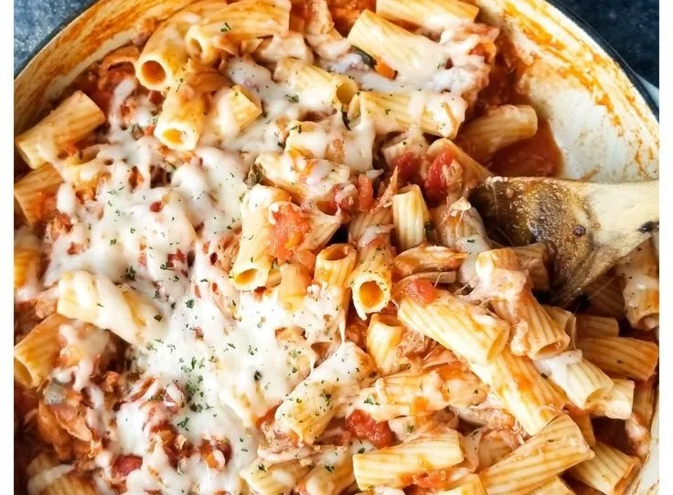 A delicious plate of easy cheesy chicken parmesan pasta topped with melted cheese.