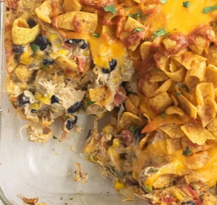 Delicious Easy Frito Chicken Casserole topped with crunchy chips.