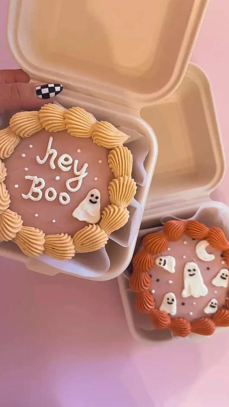 Halloween bento cakes decorated with festive themes and spooky designs.