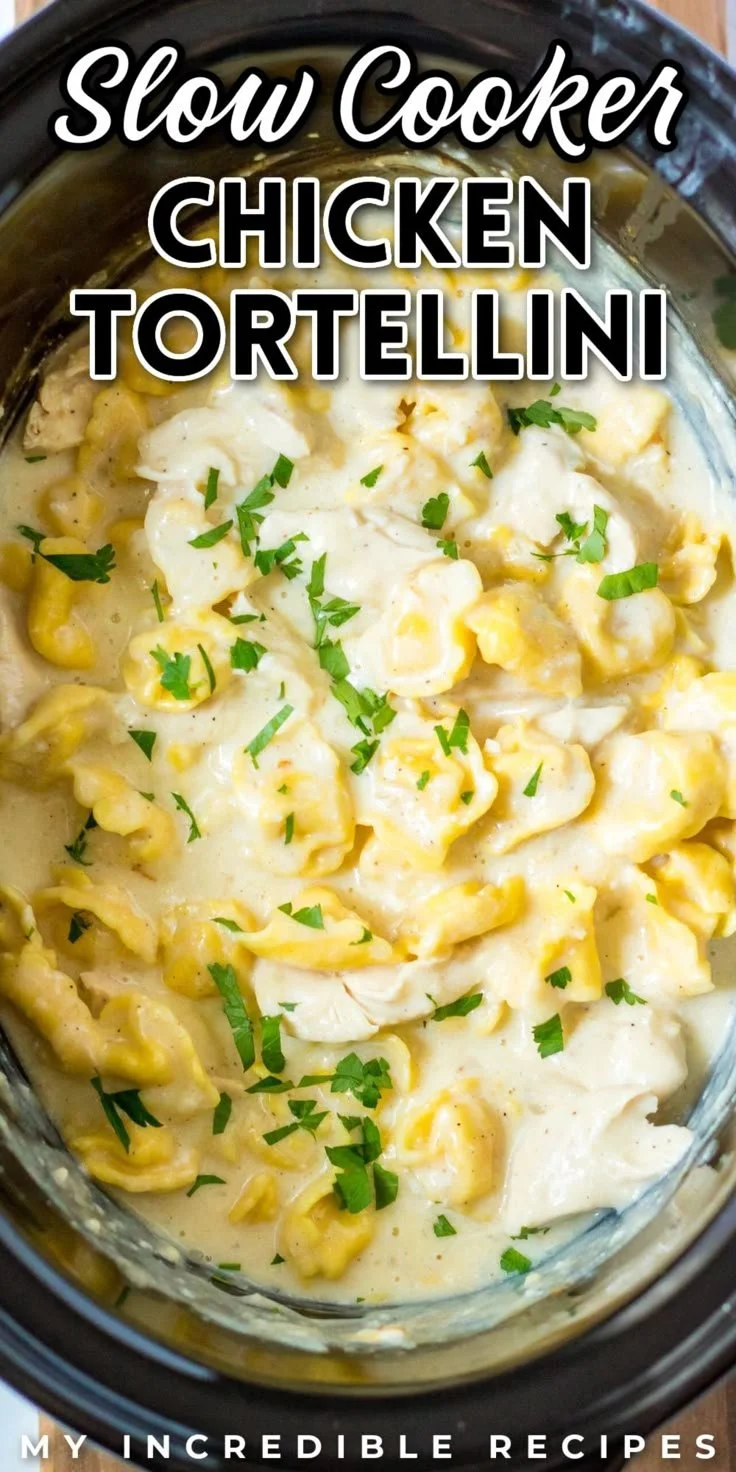 A hearty bowl of slow cooker chicken tortellini topped with herbs.